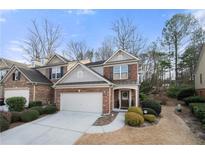 Charming brick townhome with attached garage, landscaped yard, and inviting entrance in a desirable neighborhood at 5800 Oakdale Se Rd # 165, Mableton, GA 30126