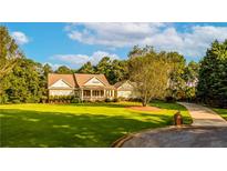 Stunning two-story home with expansive lawn and inviting front porch at 260 Koller Dr, Powder Springs, GA 30127