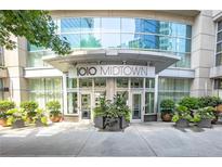 1010 Midtown building entrance with landscaping at 1080 Peachtree St # 2406, Atlanta, GA 30309