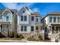 Two-story white house with red door, brick steps, and landscaping at 255 Anglin Walk, Alpharetta, GA 30009