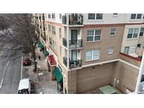 Brick building with balconies and street-level retail at 230 E Ponce De Leon Ave # 529, Decatur, GA 30030