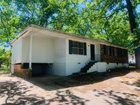 Ranch-style home with brick and white siding at 158 Scarsdale Dr, Riverdale, GA 30274