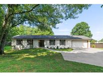 Newly renovated ranch home with a large front yard and attached two-car garage at 2685 Mars Hill Church Nw Rd, Acworth, GA 30101