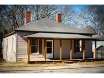 Charming craftsman style home with a wraparound porch at 3 Bay St, Covington, GA 30014