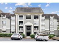Three-story apartment building with gray facade and balconies at 2657 Lenox Ne Rd # 134-2, Atlanta, GA 30324