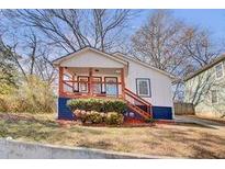 Charming renovated home with a front porch and landscaped yard at 953 Garibaldi Sw St, Atlanta, GA 30310