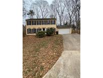Two-story house with a large yard and attached garage at 216 Ridgedale Way, Lawrenceville, GA 30044