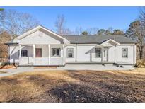 Newly renovated single story home featuring a covered porch at 2676 Old Toney Rd, Ellenwood, GA 30294