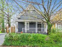 Charming gray house with white porch and well-manicured hedges at 601 Formwalt Sw St, Atlanta, GA 30312