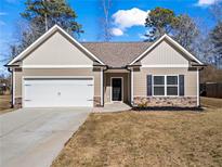 Charming single-Gathering home with a two-car garage and a well-manicured lawn in a quiet neighborhood at 45 3Rd E Ave, Dallas, GA 30157