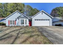 Charming one-story home with light-blue siding, a two-car garage, and well-maintained front lawn at 4815 Diggers Way, Sugar Hill, GA 30518