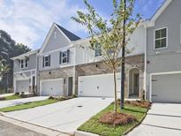 Townhomes with attached garages and landscaping at 709 Trevett Way, Marietta, GA 30062