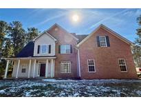 Brick two-story house with a white trim and a porch at 1835 Freeman Rd, Jonesboro, GA 30236