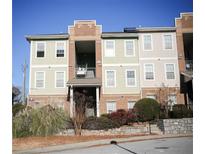 Exterior view of condo featuring balcony, traditional windows, and neat landscaping at 1752 Sw Pryor Sw Rd # 105, Atlanta, GA 30315