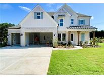 Charming two-story home featuring a brick and white facade, double garage, and a well-manicured lawn at 679 Crest Line Trl, Powder Springs, GA 30127
