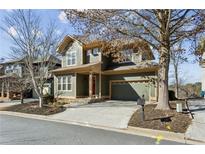 Charming two-story home with a stone driveway, mature trees, and an attached two car garage at 2765 Prado Ln, Marietta, GA 30066
