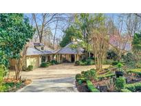 Charming home with landscaped front yard, detached garage and covered portico at 6 Arden Moor Nw, Atlanta, GA 30305