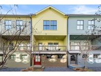 Colorful townhouses with individual entrances and balconies in a modern design community at 720 Perch Pl, Atlanta, GA 30312