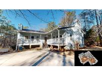 Ranch style home with large deck and wooded lot at 791 Cross Plains Hulett Rd, Carrollton, GA 30116