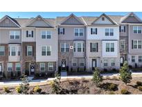 Charming townhome exteriors featuring brick facades, multiple windows, and well-maintained front yards at 532 Sonata Walk, Marietta, GA 30067