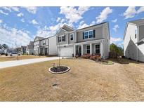 Charming two-story home featuring blue shutters and manicured front lawn at 339 Garnet Dr, Acworth, GA 30101