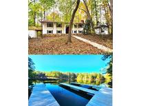 House exterior features a large deck and two-car garage at 3720 Riviera Dr, Cumming, GA 30041