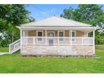 Cute cottage with a large front porch and stone accents at 1847 New Ne St, Conyers, GA 30012