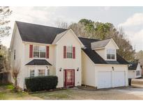 Charming two-story home featuring a two-car garage, red shutters, and a well-maintained front lawn at 59 Pompas Ct, Dallas, GA 30157