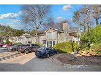 Tan multi-unit building with parking and landscaping at 2006 Augusta Se Dr, Marietta, GA 30067
