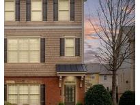 Attractive two-story home featuring a mix of brick and shake siding and shuttered windows at 3869 Felton Hill Sw Rd, Smyrna, GA 30082