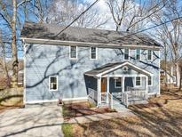 Charming two-story home with light blue siding and a welcoming front porch at 1977 Nash Se Ave, Atlanta, GA 30316
