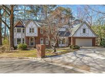 Brick two-story house with a large yard and attached garage at 3964 Preston Ne Ct, Brookhaven, GA 30319