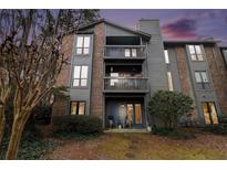 Charming condo with a multi-level balcony and beautifully landscaped surroundings at 320 Tuxworth Cir, Decatur, GA 30033