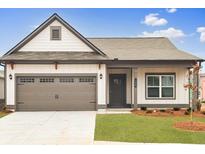 Charming single-Gathering home featuring a two-car garage, manicured lawn, and craftsman-style details at 120 Asher Dr, Carrollton, GA 30116