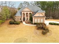 Stately two-story residence with a sprawling front yard and mature trees at 110 Robinwood Ct, Fayetteville, GA 30214