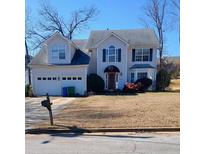 Two story house with attached two car garage, and landscaping at 2243 Glen Briar Way, Lithonia, GA 30058