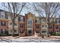 Brick building with large windows and mature trees at 25213 Plantation Ne Dr # 25213, Atlanta, GA 30324