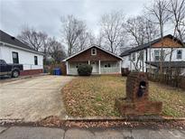 Charming exterior of a home with a well-maintained front yard and a cozy porch at 980 Linam Se Ave, Atlanta, GA 30315