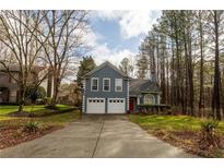 Charming two-story home featuring a two-car garage and a well-maintained front yard at 10945 Pinehigh Dr, Alpharetta, GA 30022