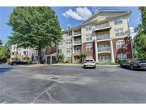 Inviting condo complex with ample parking and mature trees at 1965 Nocturne Dr # 1205A, Alpharetta, GA 30009