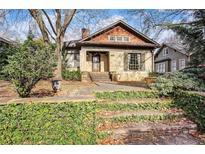 Charming brick home with cedar shake accents, beautiful stone steps and inviting curb appeal at 946 Highland Ne Vw, Atlanta, GA 30306