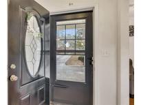 Inviting entryway with glass paneled door and decorative wreath at 5833 Westerling Pl, Powder Springs, GA 30127