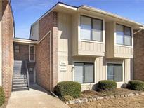 Inviting exterior of a two-story townhome with brick accents and well-maintained landscaping at 2064 Powers Ferry Se Trce, Marietta, GA 30067