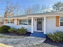 Charming single-story house with manicured front yard and brick facade at 974 Shirley Se St, Smyrna, GA 30082