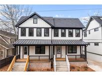 Charming two-story home with black and white trim, inviting front porch with modern railings and a well manicured yard at 971 Boulevard Se # A, Atlanta, GA 30312