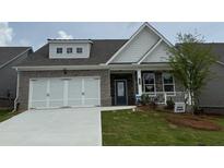 Charming one-story home featuring a brick facade, white trim, attached two-car garage and a well-manicured lawn at 2424 Anhinga Dr, Loganville, GA 30052