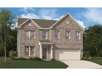 Two-story brick home featuring a two-car garage and a well-manicured lawn at 140 Kingsley Way, Acworth, GA 30102