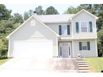 Inviting two-story home with green shutters and a spacious two-car garage at 5627 Isleworth Ct, Atlanta, GA 30349