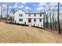 Charming two-story home with a beautifully landscaped front yard on a large lot at 800 Breckinridge Sw Rd, Marietta, GA 30064