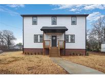 Charming two-story home featuring a brick foundation and a welcoming, covered front porch at 190 Adair Se Ave, Atlanta, GA 30315